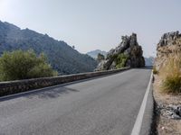 Open Road in Spain with Low Mountain Landscape