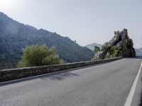 Open Road in Spain with Low Mountain Landscape