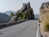 Open Road in Spain with Low Mountain Landscape