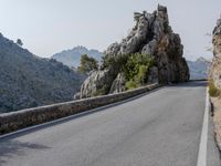 Open Road in Spain with Low Mountain Landscape