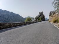Open Road in Spain with Low Mountain Landscape