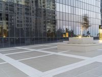 a white bench sits in the middle of an empty sidewalk between two tall buildings and buildings