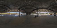 this is a 360 - view of people inside a parking garage area with lots of concrete