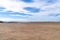 there are no people in this open desert area while there is no vegetation at the right