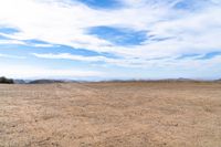 there are no people in this open desert area while there is no vegetation at the right