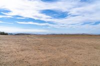 there are no people in this open desert area while there is no vegetation at the right