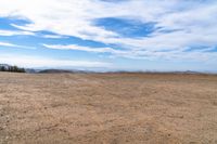 there are no people in this open desert area while there is no vegetation at the right