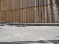 there is a skateboarder that is riding down some stairs at this building venue