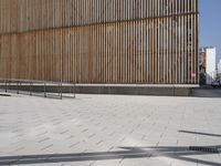 there is a skateboarder that is riding down some stairs at this building venue