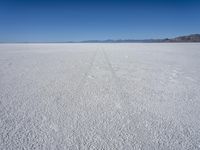 wide view of a barren, salt flat in the desert in arizona's eastern basin