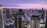 the city lights are bright as they shine at dusk in this image from a high angle