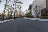 the skateboarder does tricks on the street on his board at the park of the museum