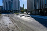 a photo of the empty street on a sunny day in chicago, united states the image depicts the cityscape and downtown buildings