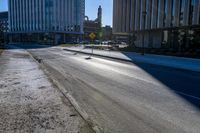 a photo of the empty street on a sunny day in chicago, united states the image depicts the cityscape and downtown buildings