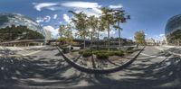 the 360 - view image shows buildings and trees in an empty road outside of a business center