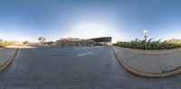 two spherical panorama images taken from a skateboarder doing a trick on the street