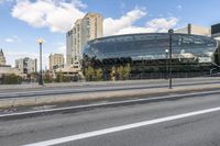 an image of a very nice looking building that is by some street side lines and trees