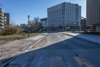 a city street that is empty and has no people or cars in it and has buildings on either side