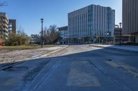 a city street that is empty and has no people or cars in it and has buildings on either side