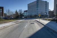 a city street that is empty and has no people or cars in it and has buildings on either side