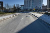 a city street that is empty and has no people or cars in it and has buildings on either side