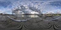 there is a fisheye view of an outdoor event venue that features seating and lake