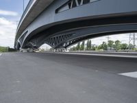 an overhead highway with bridge and street on both sides of the road and a sky background