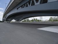 an overhead highway with bridge and street on both sides of the road and a sky background