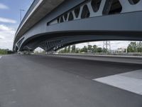 an overhead highway with bridge and street on both sides of the road and a sky background