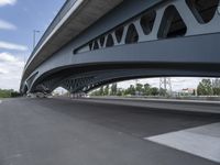 an overhead highway with bridge and street on both sides of the road and a sky background