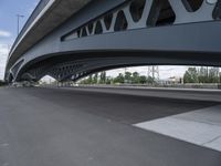 an overhead highway with bridge and street on both sides of the road and a sky background