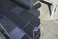 an overhead view shows the intersection at an intersection of two streets and two people crossing