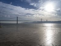 a view of the bay bridge and a person on a skateboard at a water park