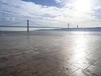 a view of the bay bridge and a person on a skateboard at a water park