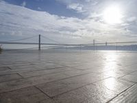 a view of the bay bridge and a person on a skateboard at a water park