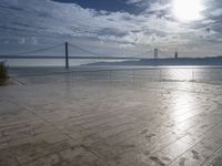 a view of the bay bridge and a person on a skateboard at a water park