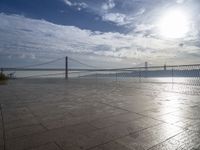 a view of the bay bridge and a person on a skateboard at a water park