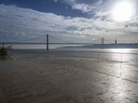 a view of the bay bridge and a person on a skateboard at a water park