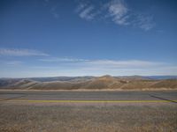 a deserted highway is shown with no traffic signs on either side of the road,