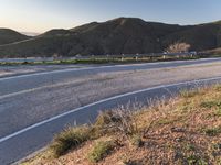 the view from the front of the car as it drives on a deserted highway with two side by side lanes,