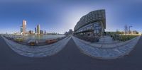 a fisheye lens is a panoramic view of buildings across the bay in front