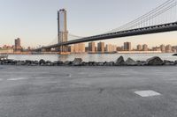 a city has been photographed in the foreground as the bridge spans into the distance