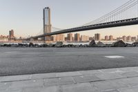 a city has been photographed in the foreground as the bridge spans into the distance