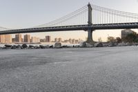 a city has been photographed in the foreground as the bridge spans into the distance