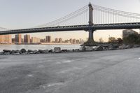 a city has been photographed in the foreground as the bridge spans into the distance