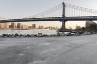 a city has been photographed in the foreground as the bridge spans into the distance