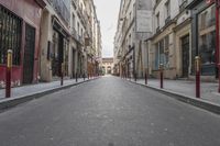 an empty street is pictured next to tall buildings in paris, france on march 3