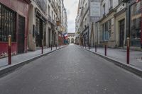 an empty street is pictured next to tall buildings in paris, france on march 3