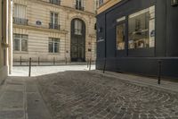 a bicycle that is sitting in the middle of a street in paris by a building