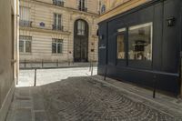 a bicycle that is sitting in the middle of a street in paris by a building